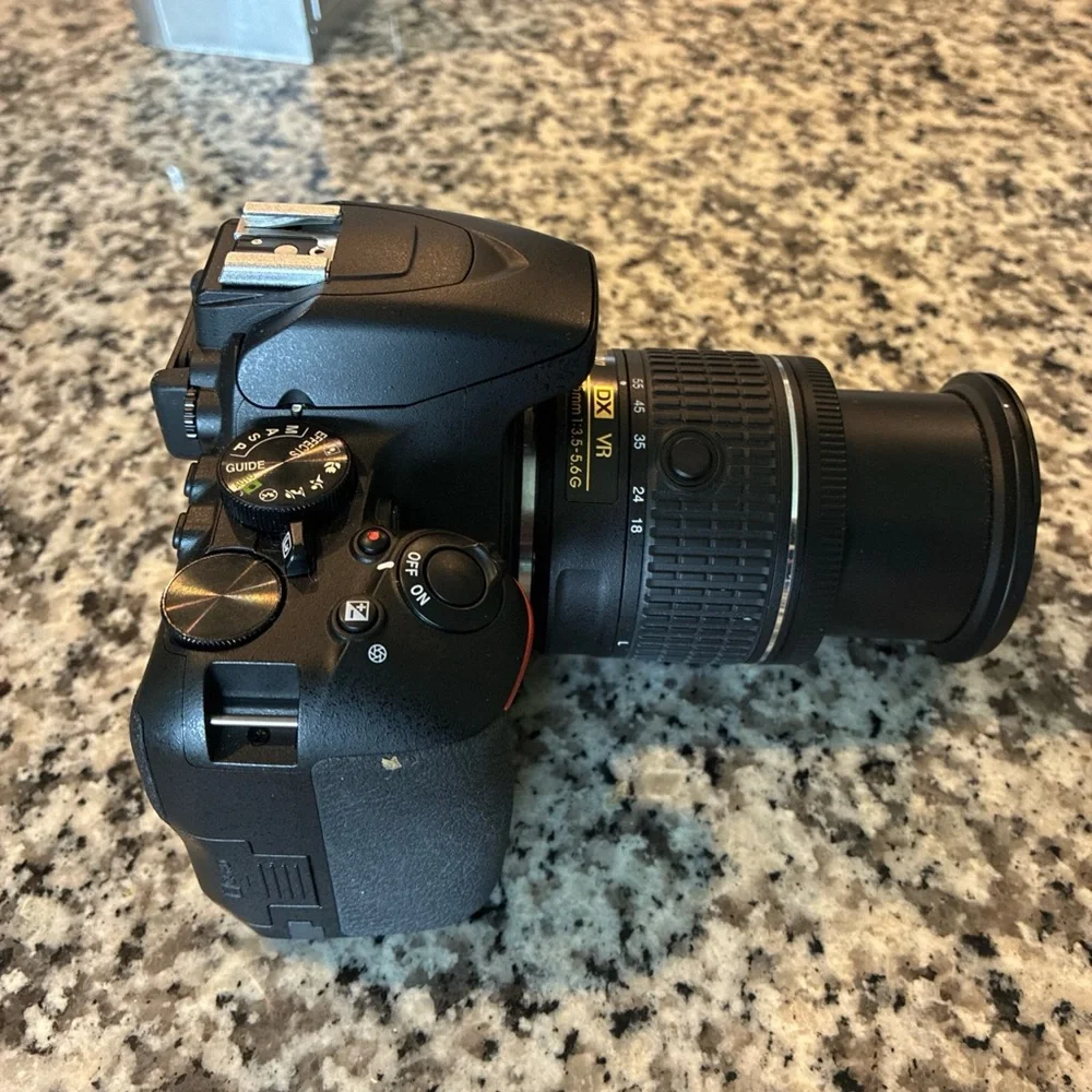 Nikon Black Digital Camera with Ergonomic Design and Professional Lens